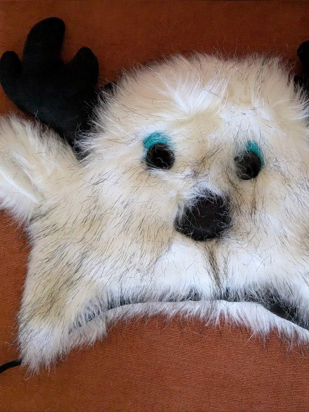Plush White Faux Fur Moose Hat with Turquoise Eye Accents